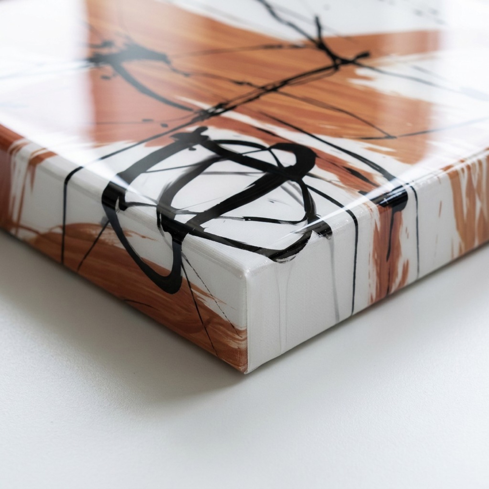 Corner of a glossy gallery-wrapped canvas.