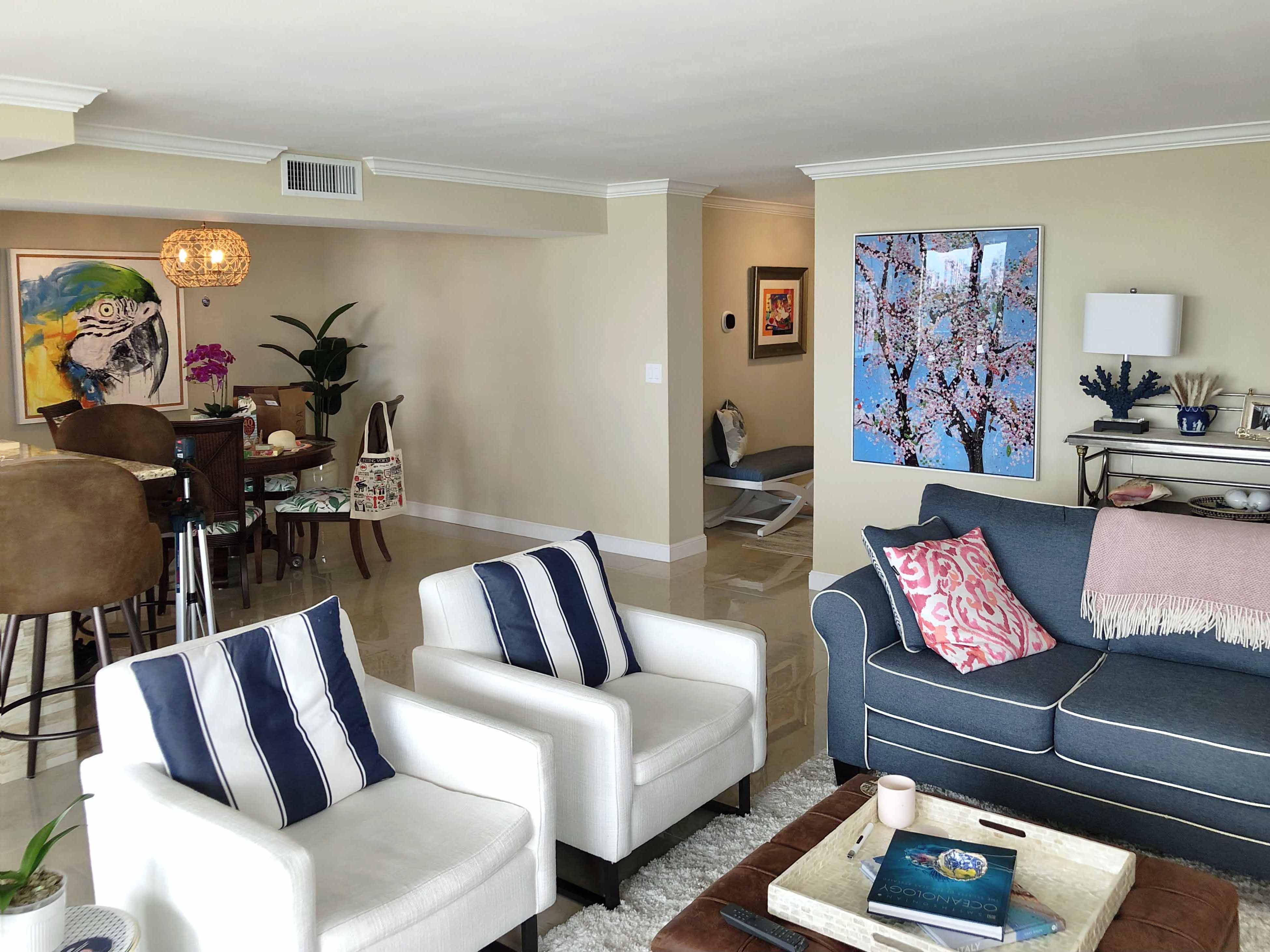 Large acrylic-mounted art hung in a bright Fort Lauderdale condo.