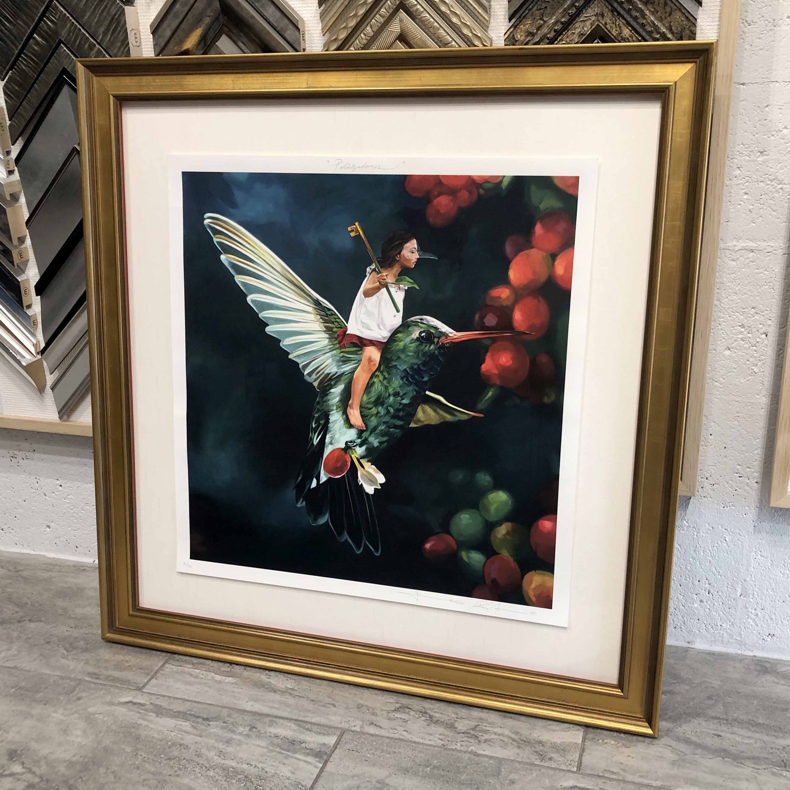 Limited edition print in gold frame with cream and red double mat.